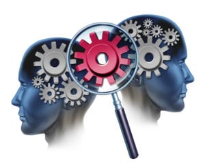 Image of two heads with gears and a central gear connecting them.
