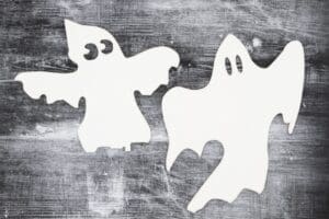 An image containing two cut outs of ghost outlines.